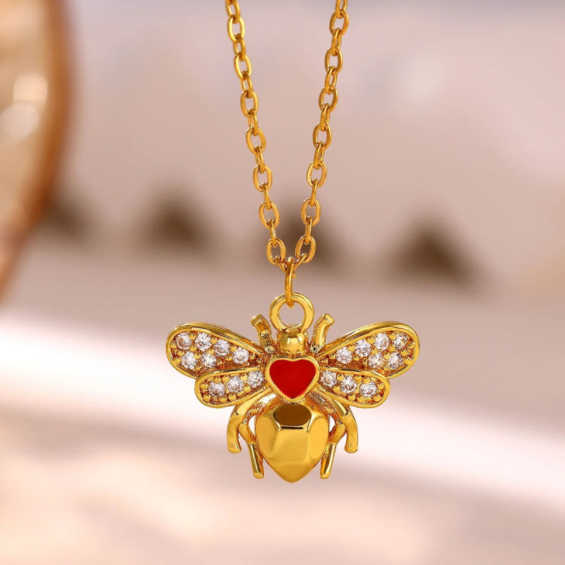 Golden bee necklace with ruby heart and sparkling crystals