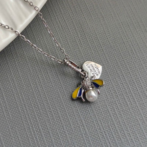 Detailed view of Silver Bee Honey Pearl Necklace