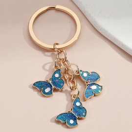 Porte-clés papillon bleu étincelant