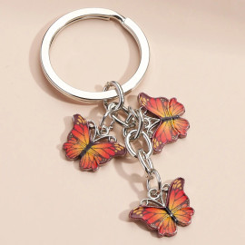 Porte-clés papillon en résine et strass - couleur orange